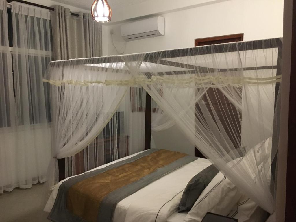 Postel nebo postele na pokoji v ubytování Dumbara Peak Residence