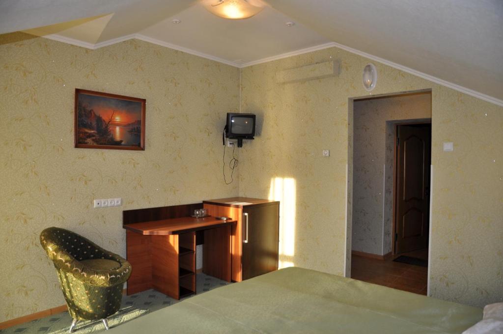 Postel nebo postele na pokoji v ubytování Focus Hotel