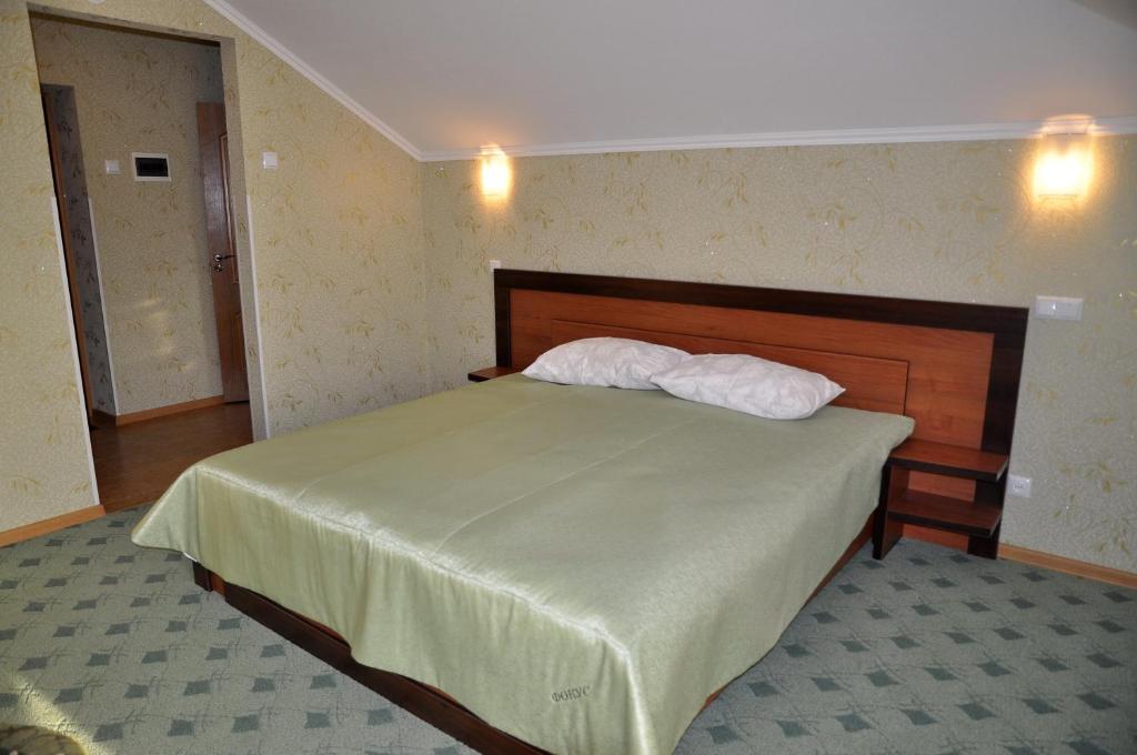 Postel nebo postele na pokoji v ubytování Focus Hotel