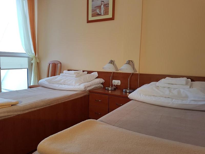 Postel nebo postele na pokoji v ubytování Hotel Ustka