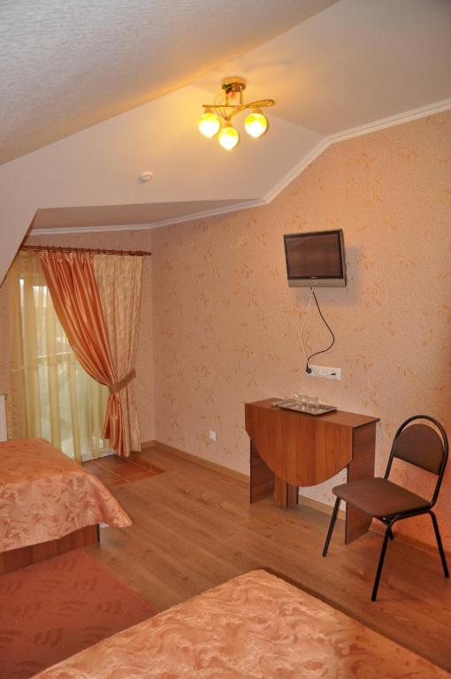 TV a/nebo společenská místnost v ubytování Focus Hotel