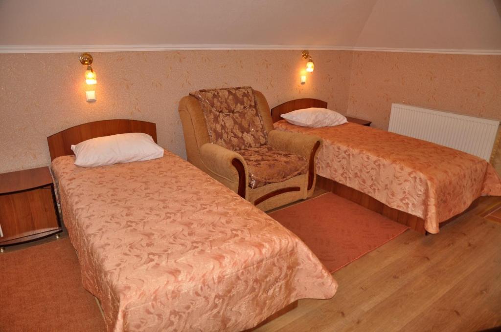 Postel nebo postele na pokoji v ubytování Focus Hotel