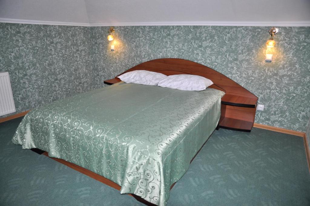 Postel nebo postele na pokoji v ubytování Focus Hotel