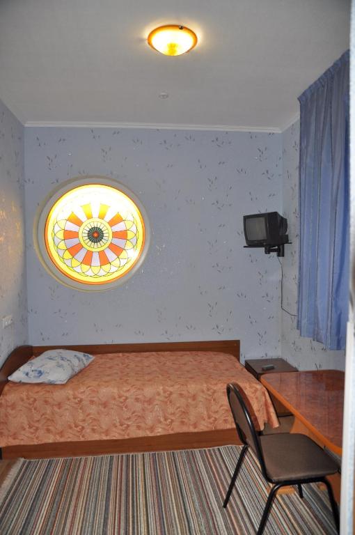 Postel nebo postele na pokoji v ubytování Focus Hotel