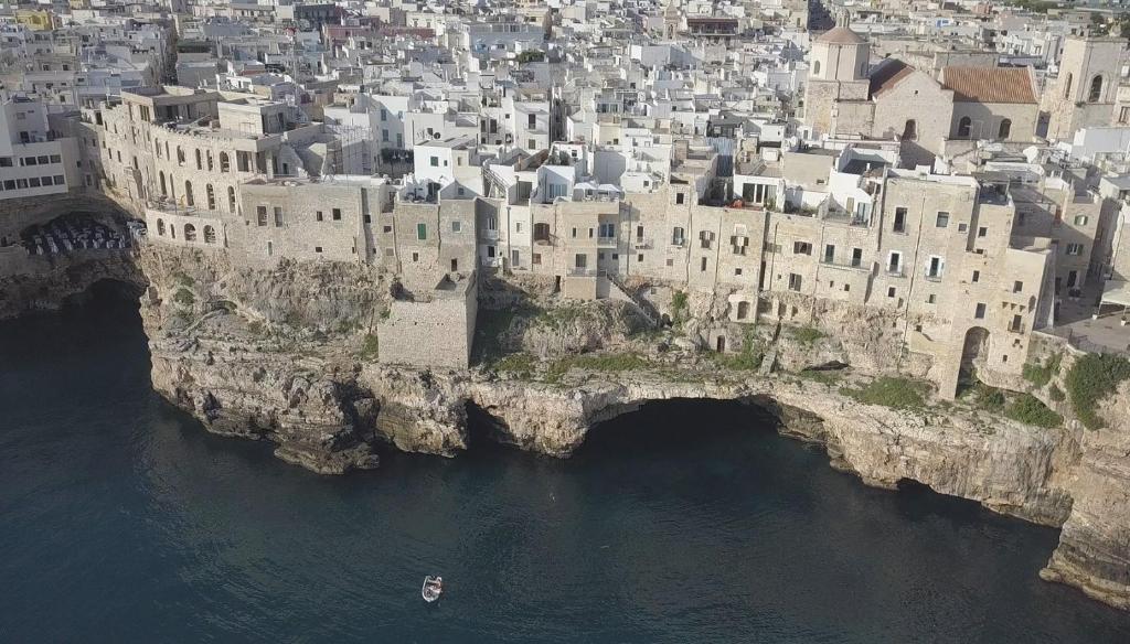 an aerial view of a city on a rocky island in the water at Dimora Talenti in Polignano a Mare
