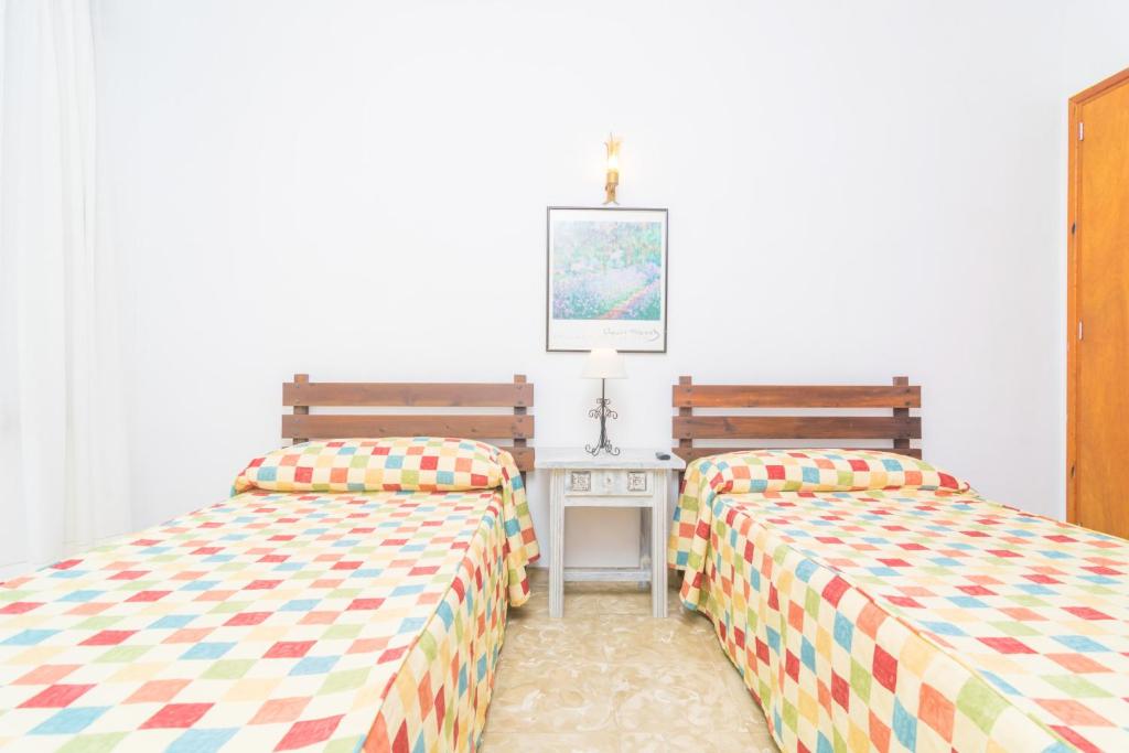 Posteľ alebo postele v izbe v ubytovaní Casa Tradicional Can Picafort