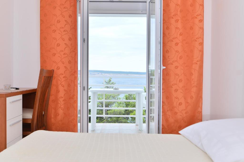 Postel nebo postele na pokoji v ubytování Apartmani Smiljanic