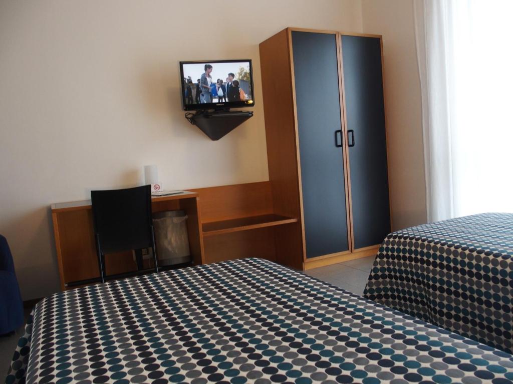 Postel nebo postele na pokoji v ubytování Hotel Eden