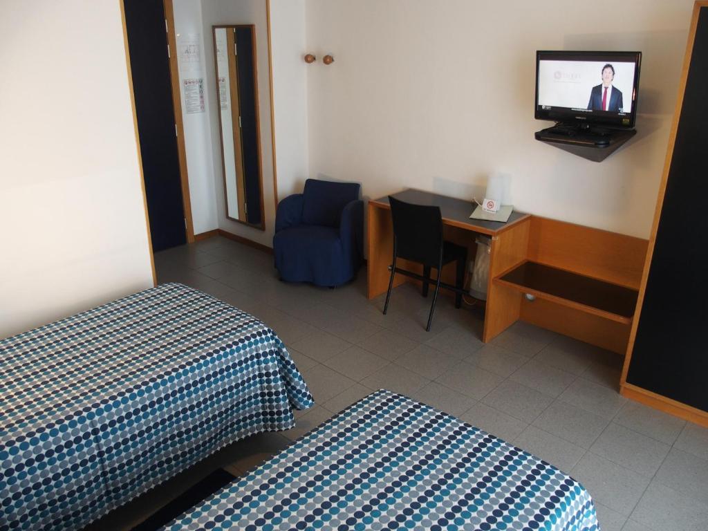 TV a/nebo společenská místnost v ubytování Hotel Eden