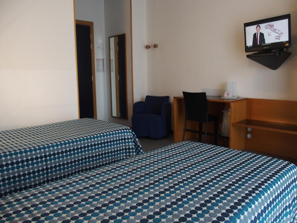 Postel nebo postele na pokoji v ubytování Hotel Eden