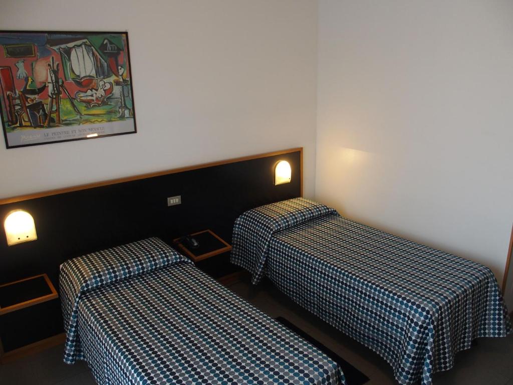 Postel nebo postele na pokoji v ubytování Hotel Eden