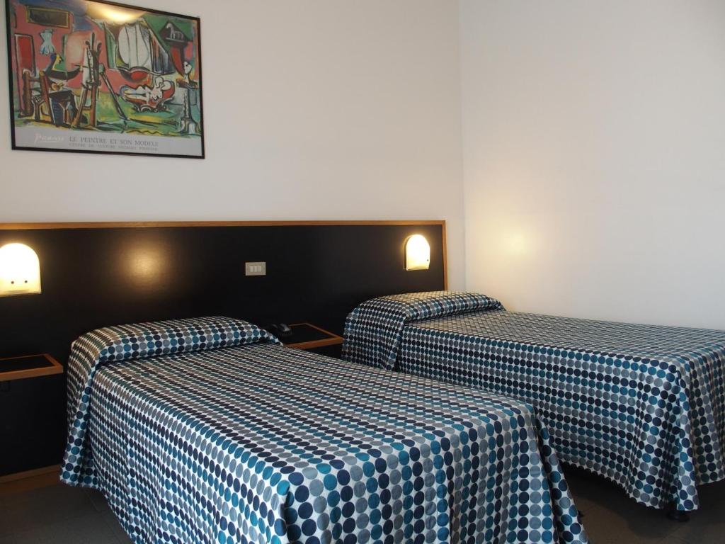 Postel nebo postele na pokoji v ubytování Hotel Eden