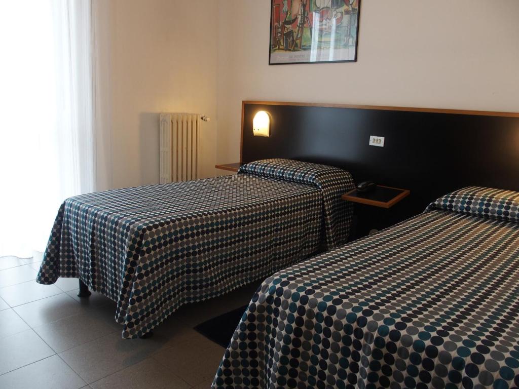 Postel nebo postele na pokoji v ubytování Hotel Eden