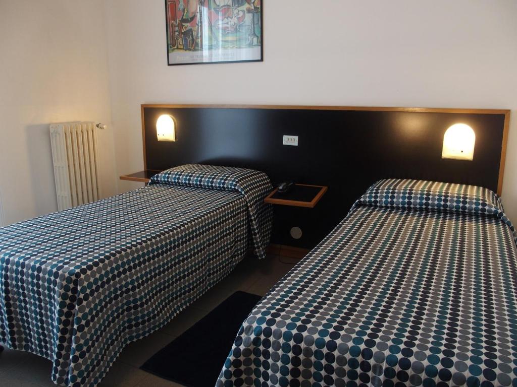 Postel nebo postele na pokoji v ubytování Hotel Eden