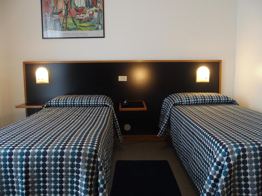 Postel nebo postele na pokoji v ubytování Hotel Eden