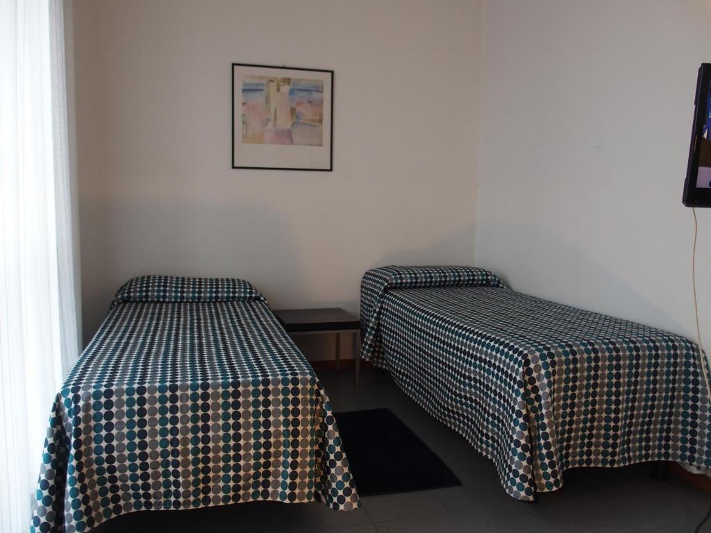 Postel nebo postele na pokoji v ubytování Hotel Eden