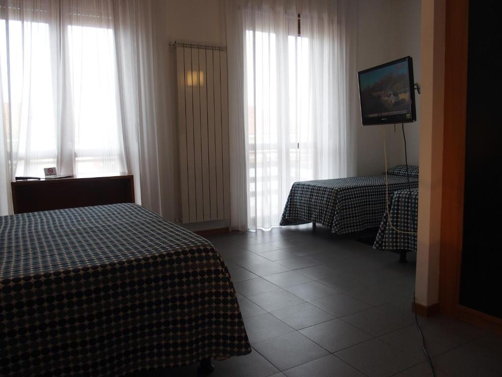 Postel nebo postele na pokoji v ubytování Hotel Eden