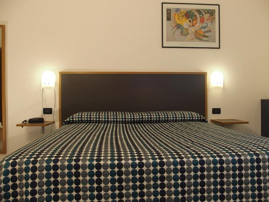 Postel nebo postele na pokoji v ubytování Hotel Eden