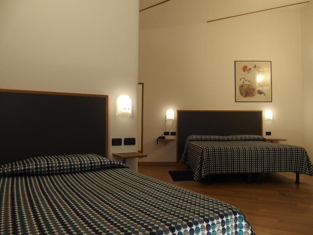 Postel nebo postele na pokoji v ubytování Hotel Eden