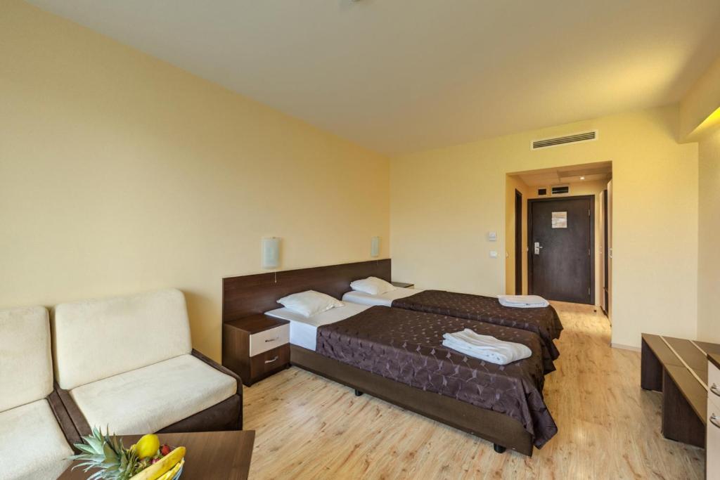 Postel nebo postele na pokoji v ubytování Hotel Arena