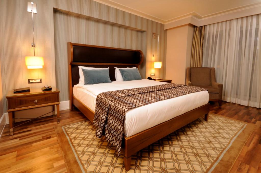 Postel nebo postele na pokoji v ubytování Titanic City Taksim