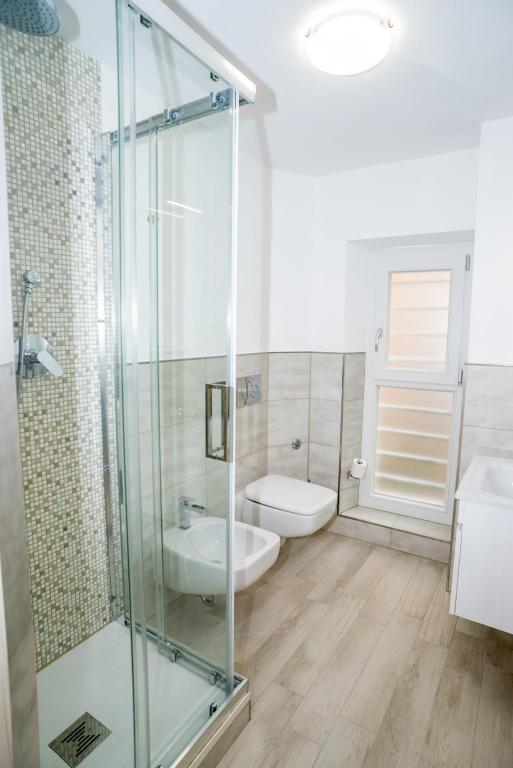 Koupelna v ubytování Eden Rooms