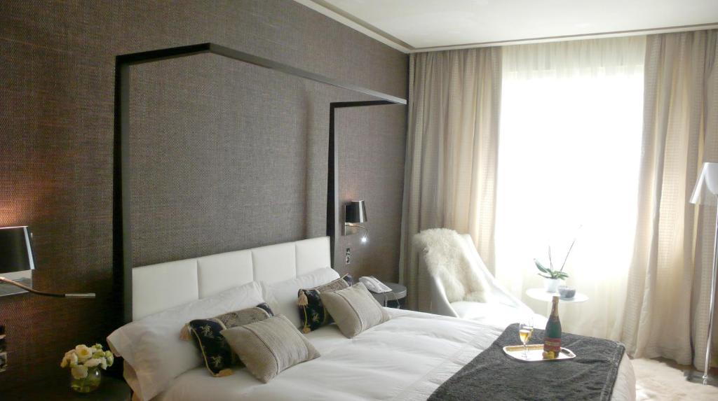 A bed or beds in a room at Gran Hotel Nagari Boutique & Spa