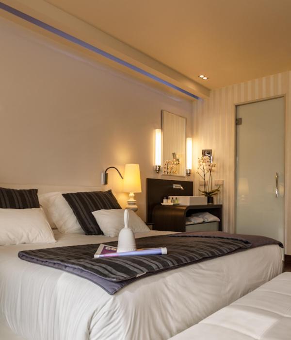 A bed or beds in a room at Gran Hotel Nagari Boutique & Spa
