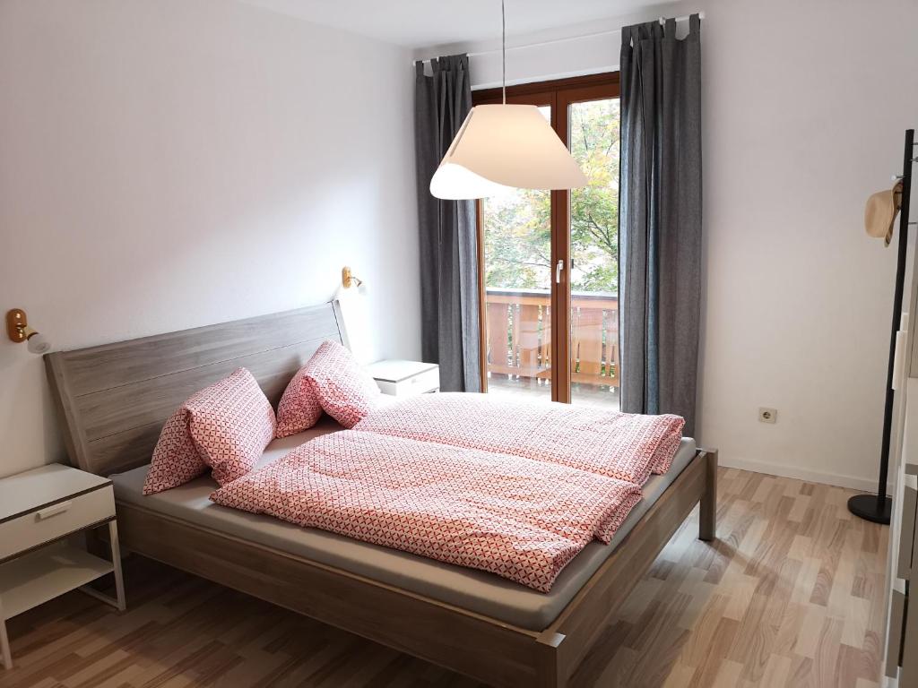Postel nebo postele na pokoji v ubytování Appartment Scharleralm