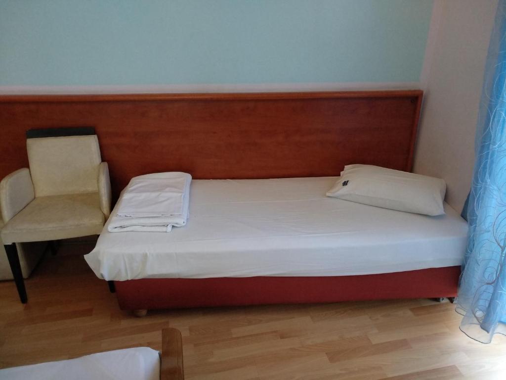 Postel nebo postele na pokoji v ubytování Diethnes Hotel