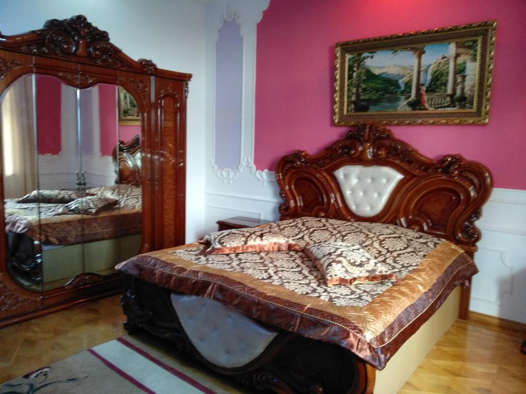 Postel nebo postele na pokoji v ubytování Hotel Royal
