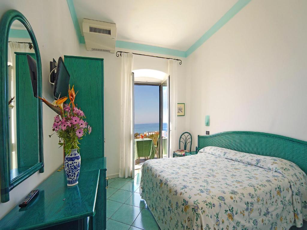 Postel nebo postele na pokoji v ubytování Hotel Casa del Sole