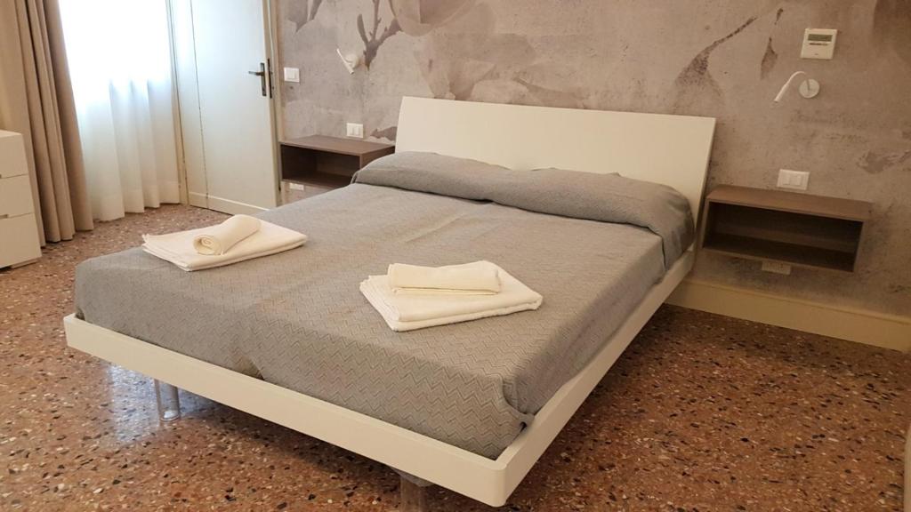 Łóżko lub łóżka w pokoju w obiekcie Cà Riva del Vin