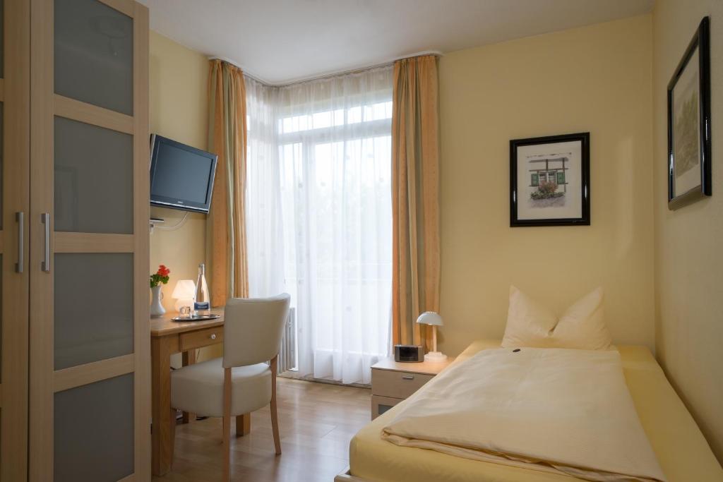 Postel nebo postele na pokoji v ubytování Hotel Nora