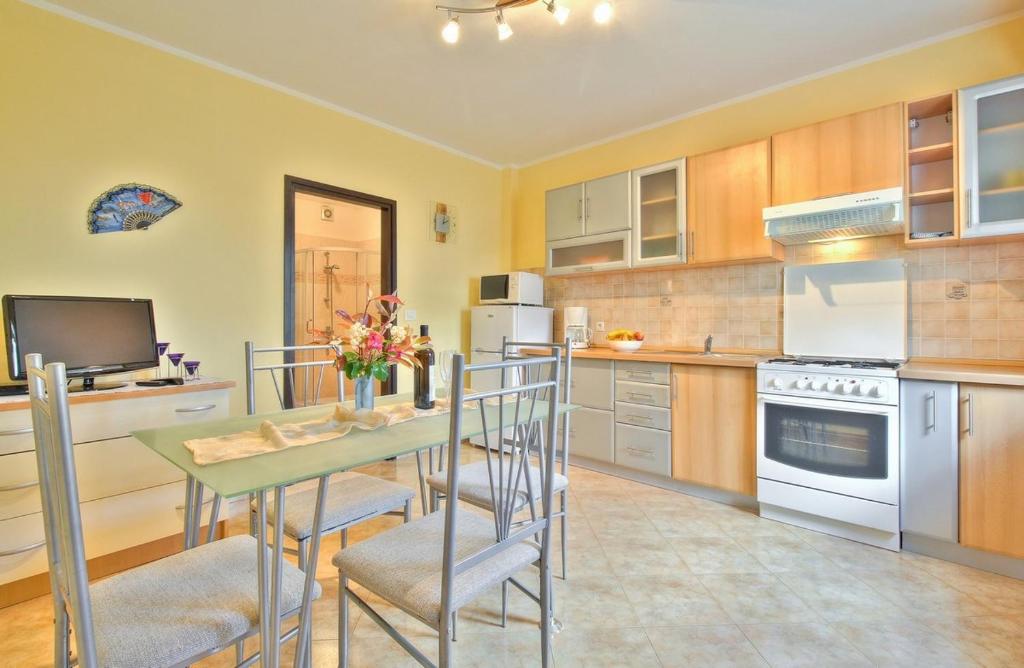 Kuchyň nebo kuchyňský kout v ubytování Lorena Apartments