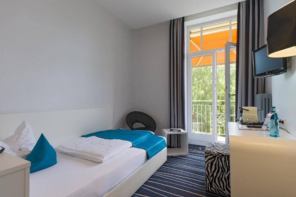 Postel nebo postele na pokoji v ubytování Sure Hotel by Best Western Bad Dürrheim