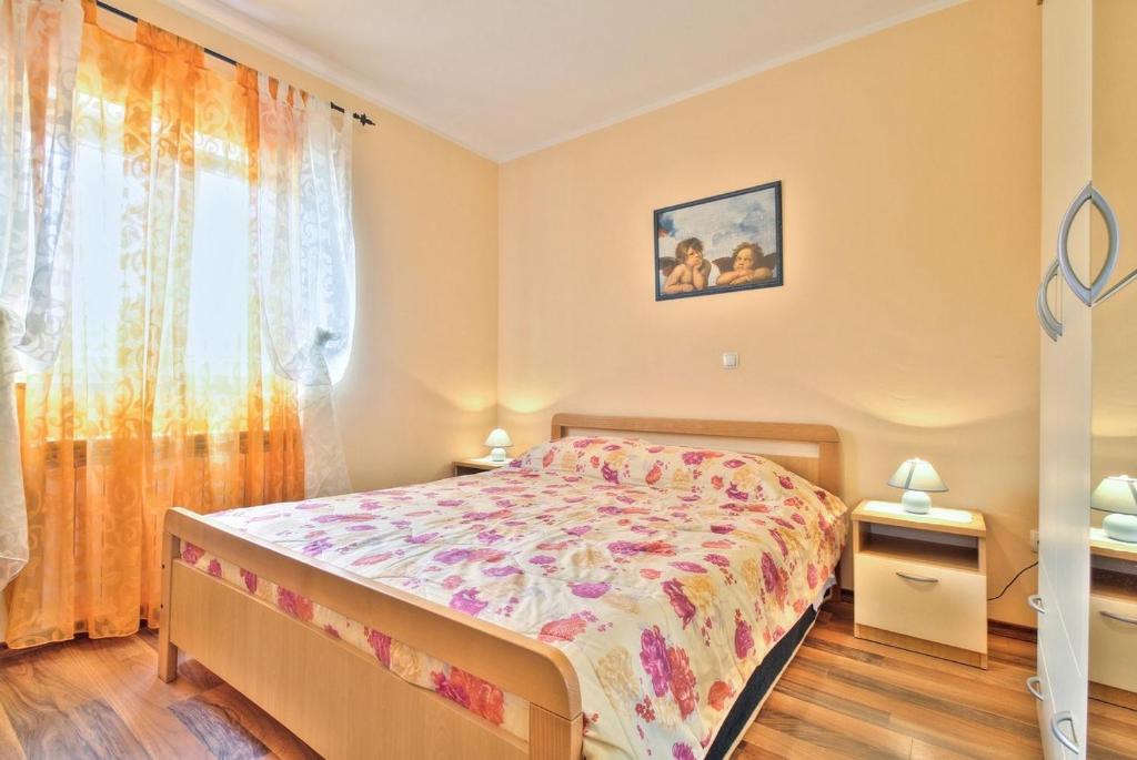 Postel nebo postele na pokoji v ubytování Lorena Apartments