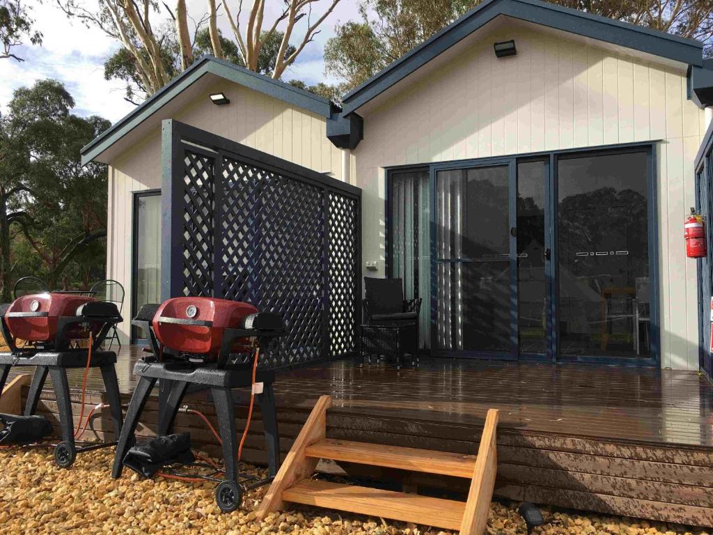 a deck with two bbqs and a grill at Coonawarra Ensuite Unit C in Coonawarra