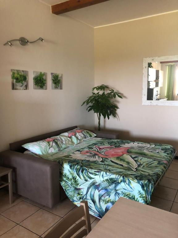 Posteľ alebo postele v izbe v ubytovaní Appartamento Rosegarden