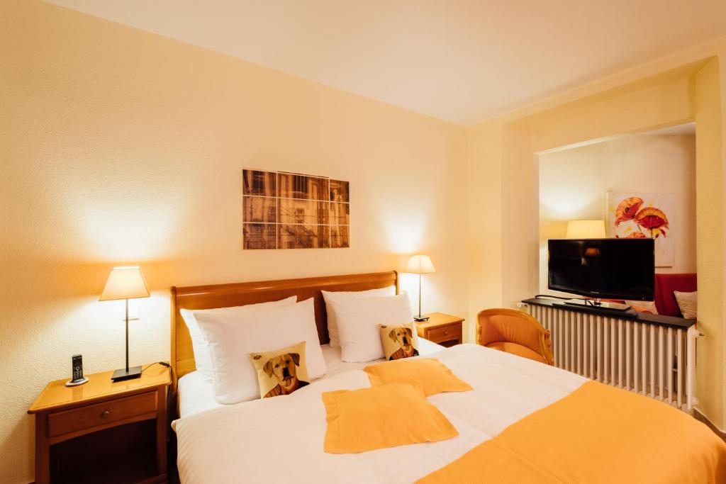 Postel nebo postele na pokoji v ubytování Hotel zur Mühle