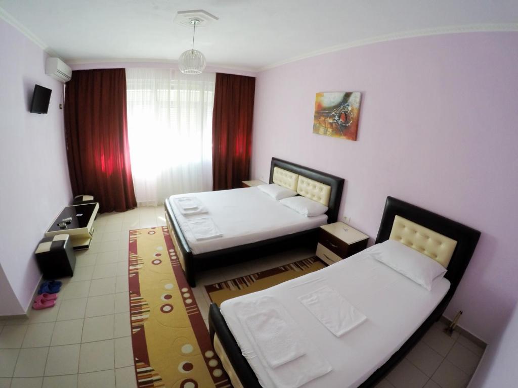 Llit o llits en una habitació de Hotel Freskia