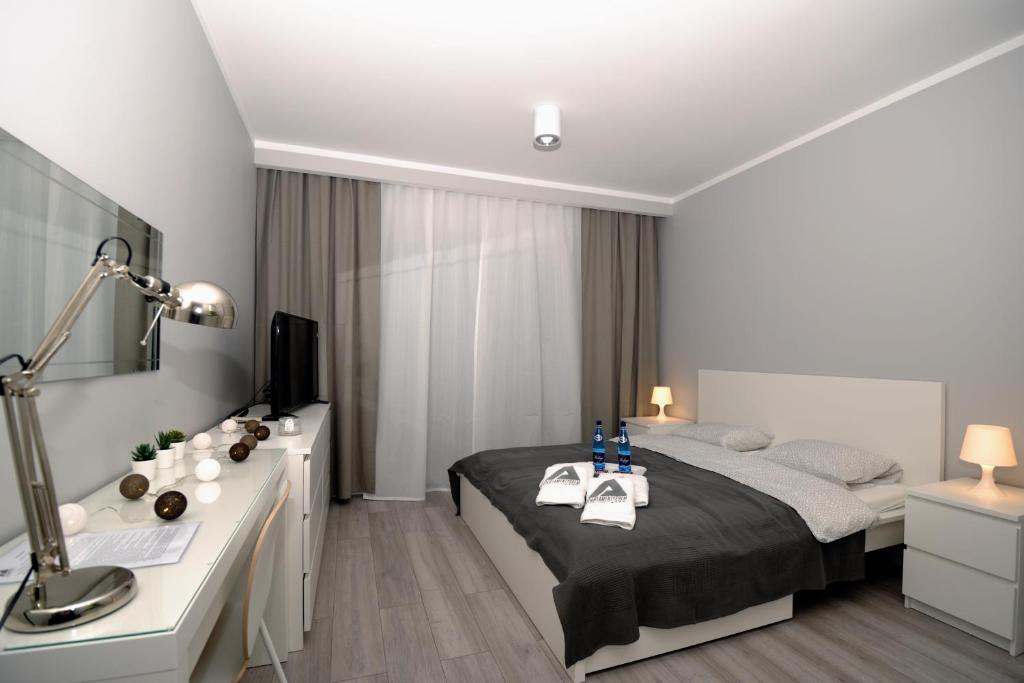 Postel nebo postele na pokoji v ubytování Apartament KORNER Chełmońskiego Śrem
