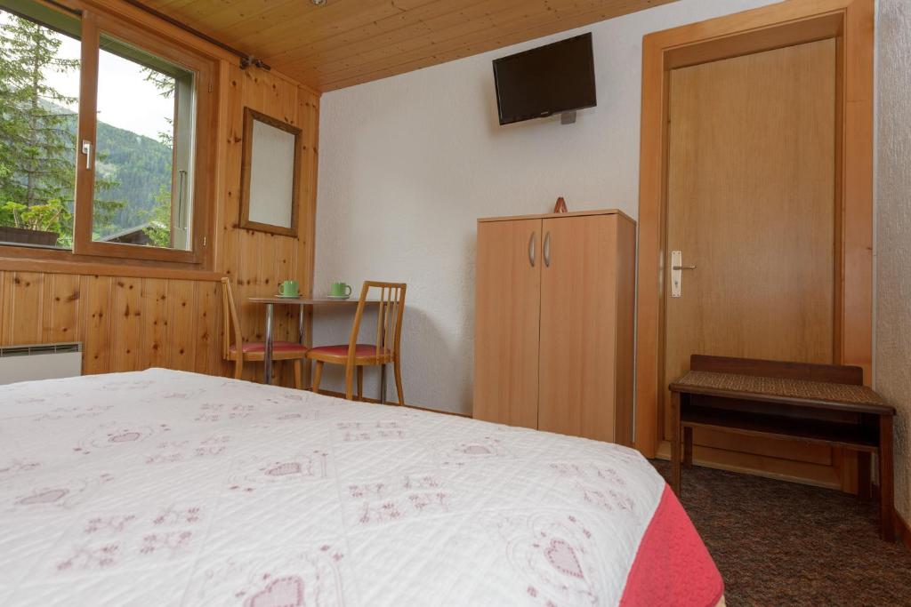 Postel nebo postele na pokoji v ubytování Au Bivouac de Napoléon et Spa