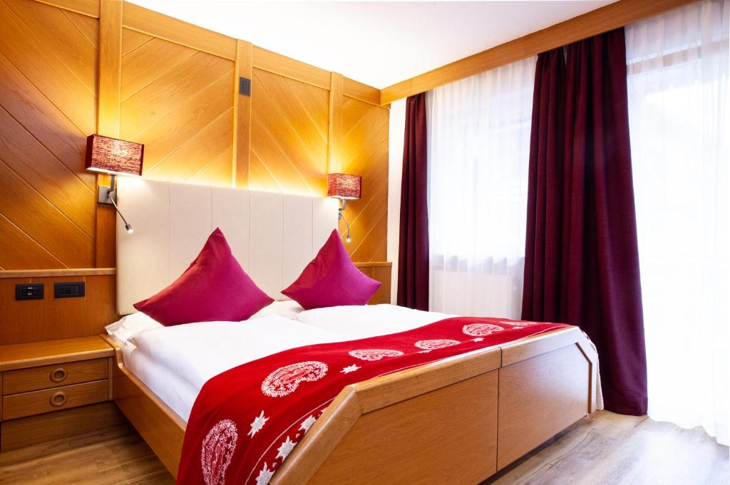 Postel nebo postele na pokoji v ubytování Hotel Cirelle Suite & Spa