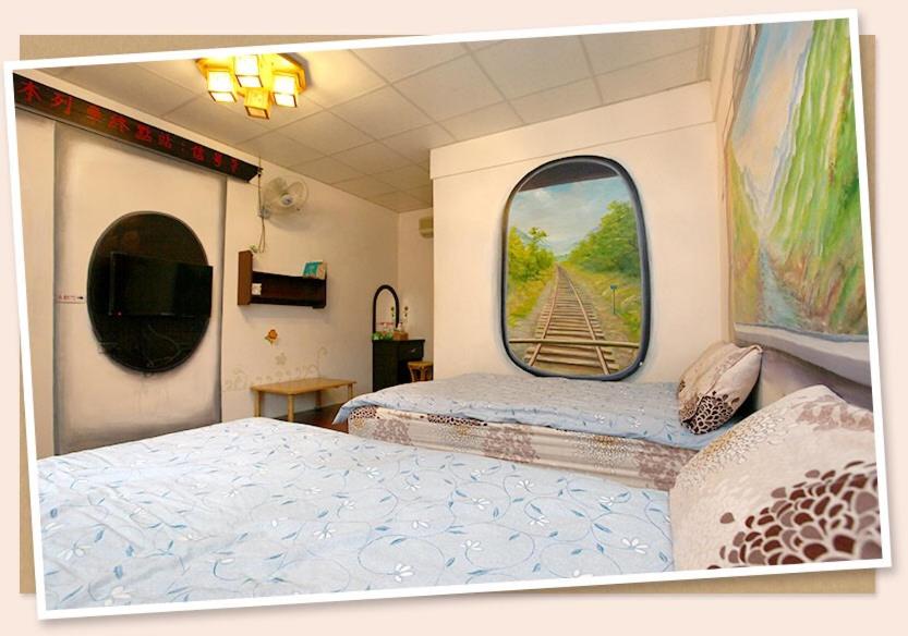 Postel nebo postele na pokoji v ubytování Signal B&B 信號咖ㄟ厝 民宿
