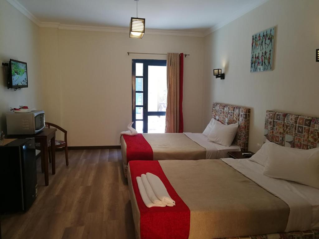 Postel nebo postele na pokoji v ubytování Cordoba Suites