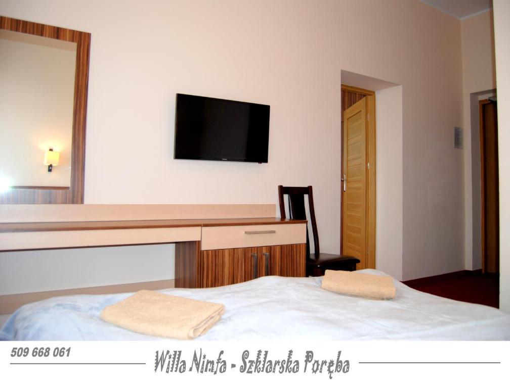 Posteľ alebo postele v izbe v ubytovaní Willa Nimfa pokoje i apartamenty, również cała willa na wyłączność