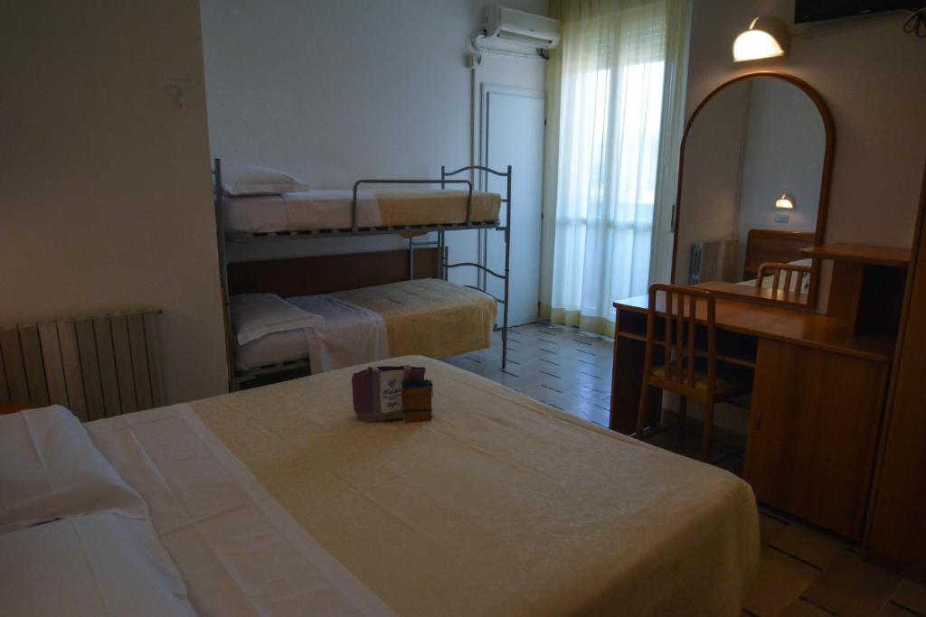 Postel nebo postele na pokoji v ubytování Hotel Zani