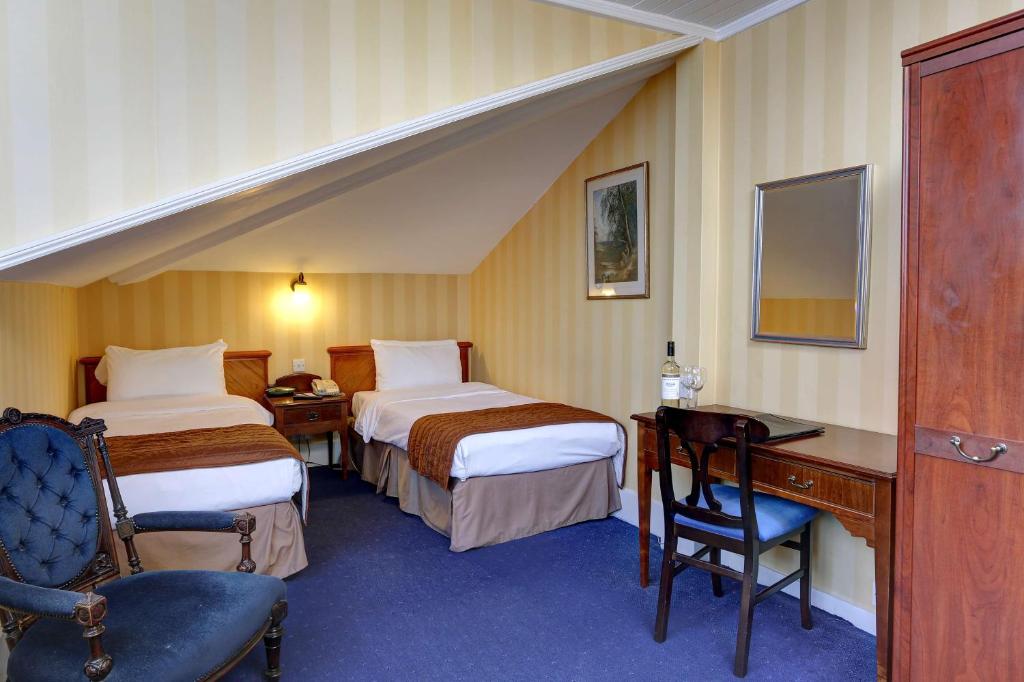 Postel nebo postele na pokoji v ubytování Best Western Swiss Cottage Hotel