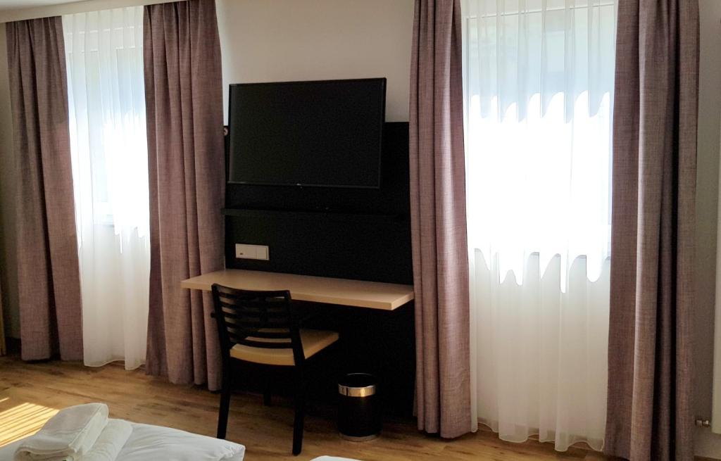 TV a/nebo společenská místnost v ubytování Hotel U7